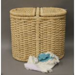 A wicker laundry basket and a quantity of cotton doilies. The former 50 cm high.