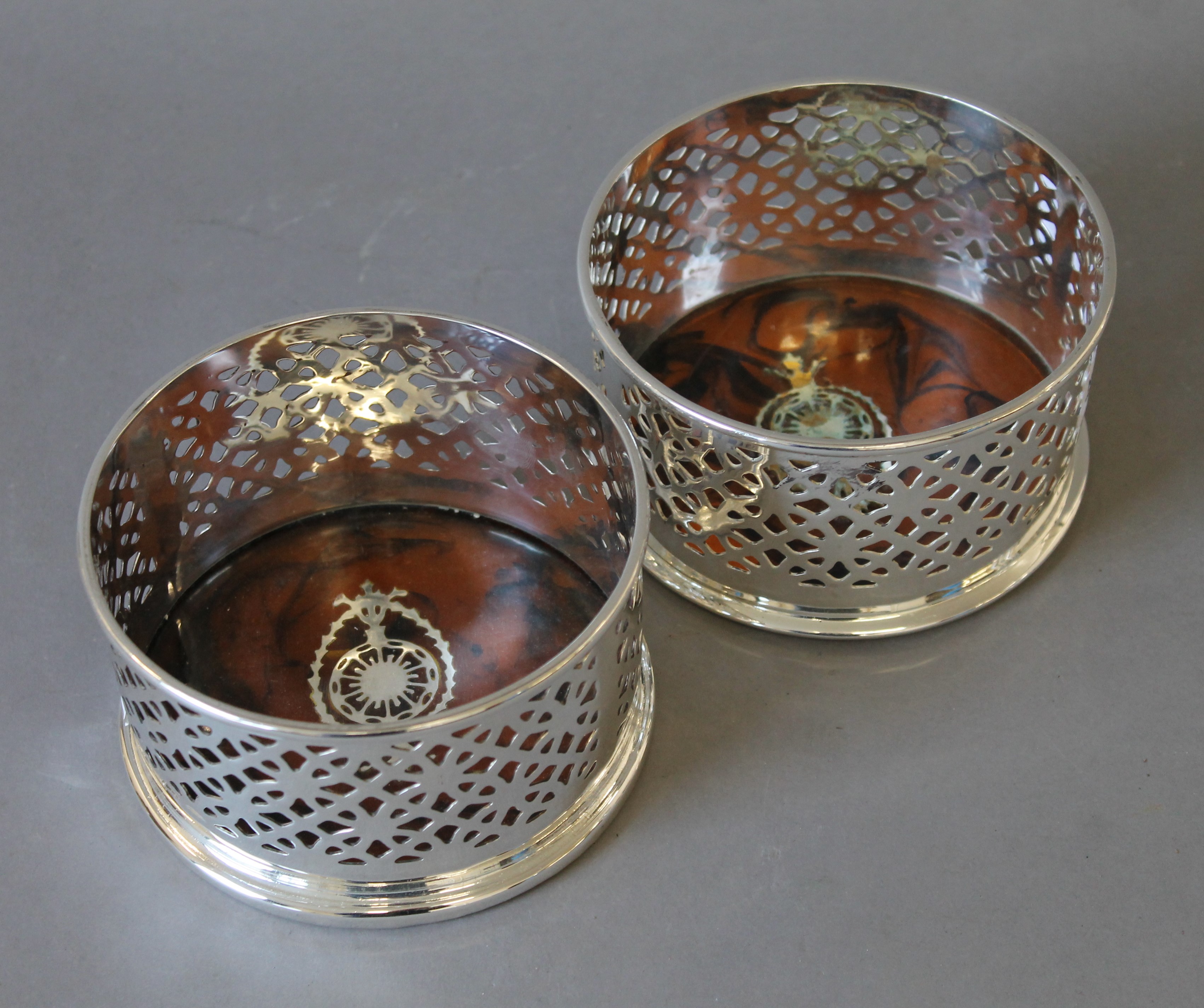 A pair of silver plated coasters. 12.5 cm diameters. - Image 2 of 4