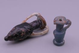 Two Egyptian glass amphora. 6.5 cm high and 3.5 cm high respectively.