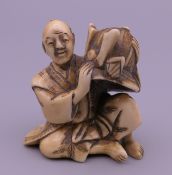 A 19th century Japanese ivory netsuke formed as a warrior.