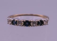 A 9 ct gold ring. Ring size T. 1.7 grammes total weight.