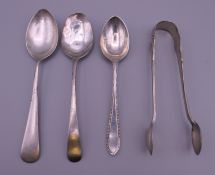 Three silver spoons and a pair of silver sugar tongs. Tongs 11 cm long. 71.1 grammes.