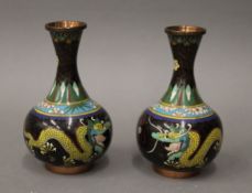 A pair of cloisonne vases decorated with dragons. 15 cm high.