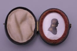 A Georgian Miers and Field heightened portrait silhouette miniature, mounted in a leather case. 4.