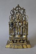 An Eastern gilt bronze shrine. 28 cm high.