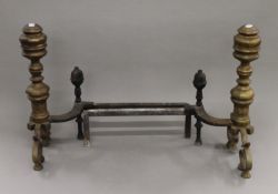 A pair of brass andirons. 23 cm high.