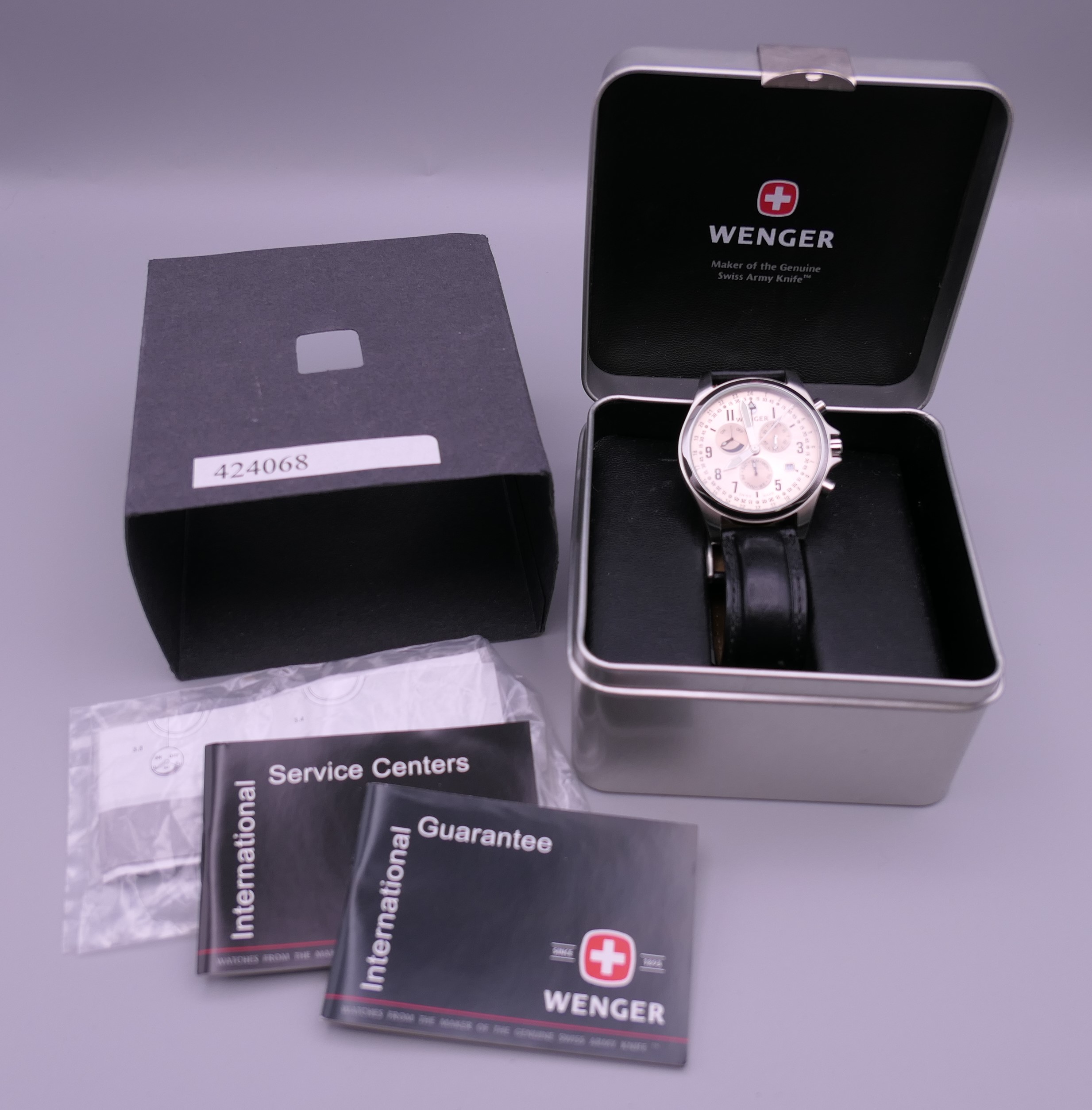 A boxed Wenger wristwatch. 4.5 cm wide.