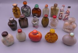 A collection of antique Chinese snuff bottles, including jade, porcelain, ivory,