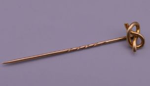 A boxed 18 ct gold stick pin. 6.5 cm long. 2.9 grammes.