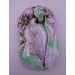 A large two tone jade pendant. 10 x 6 cm.