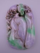 A large two tone jade pendant. 10 x 6 cm.