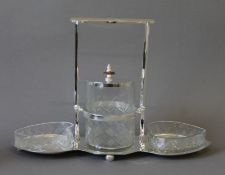 A silver plated and glass jam set. 34 cm wide.