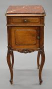 A 19th century French rouge marble topped pot cupboard. 81 cm high.
