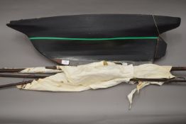 A large early 20th century pond yacht with sails, etc. 95 cm long.