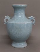 A Chinese porcelain pale blue vase. 30 cm high.