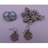 A pair of silver earrings and two silver brooches. Bouquet brooch 5 cm high.