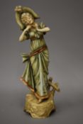 An Austrian Art Nouveau blush figure of a lady. 32 cm high.