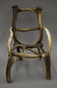 A stag antler child's chair. 42 cm high.