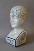 A porcelain phrenology head. 41 cm high.