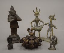 A quantity of various Indian and African bronzes, including a small spice box. The largest 9.