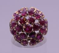A vintage 14 K gold ruby cocktail ring (one stone lacking). Ring size K/L.