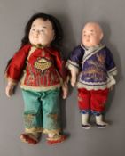 Two vintage Chinese dolls. The largest 26 cm high.