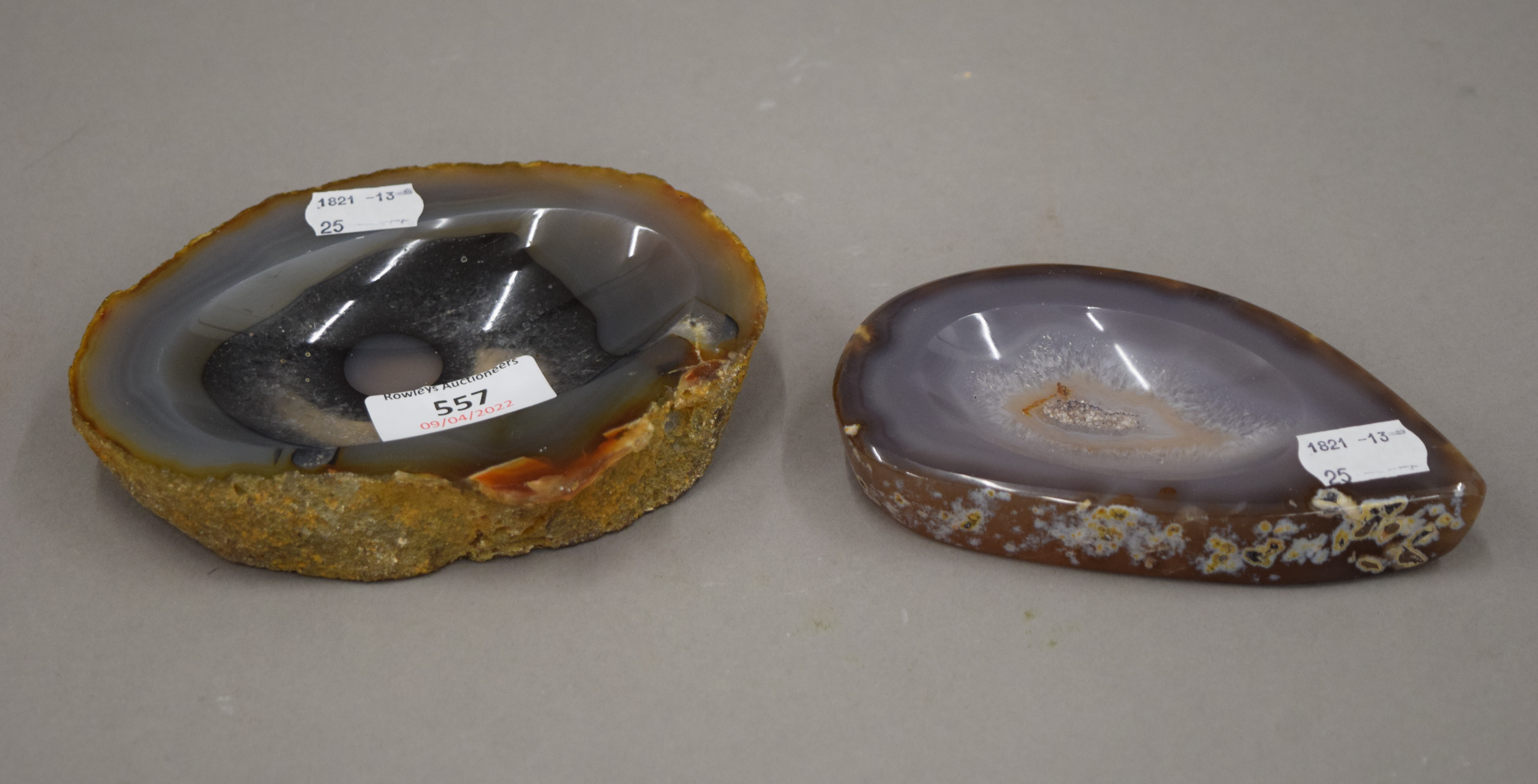 Two small mineral specimen trays. The largest 14.5 cm wide.