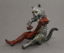 A cold painted bronze model of a cat in boots. 7.5 cm high.