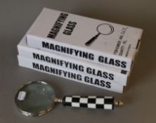 Four various magnifying glasses.