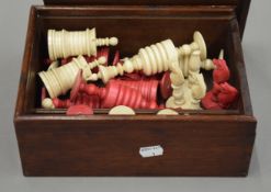 A boxed Victorian bone and stained bone chess set. The kings 14.5 cm high.