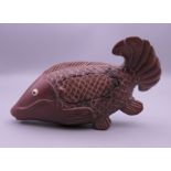 A Japanese wooden model of a fish. 12.5 cm long.