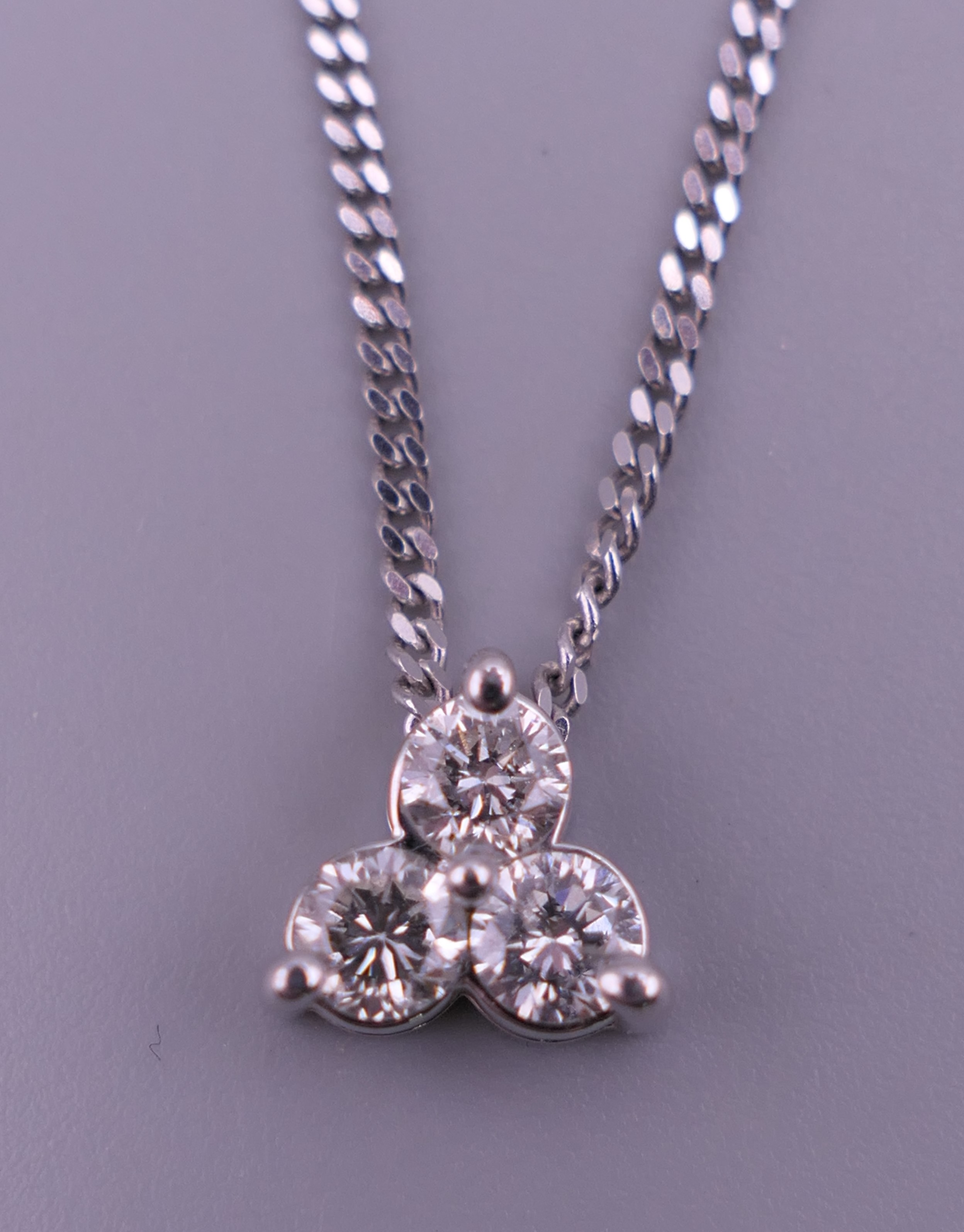 An 18 ct white gold and diamond necklace and pendant and a pair of matching earrings. - Image 3 of 8