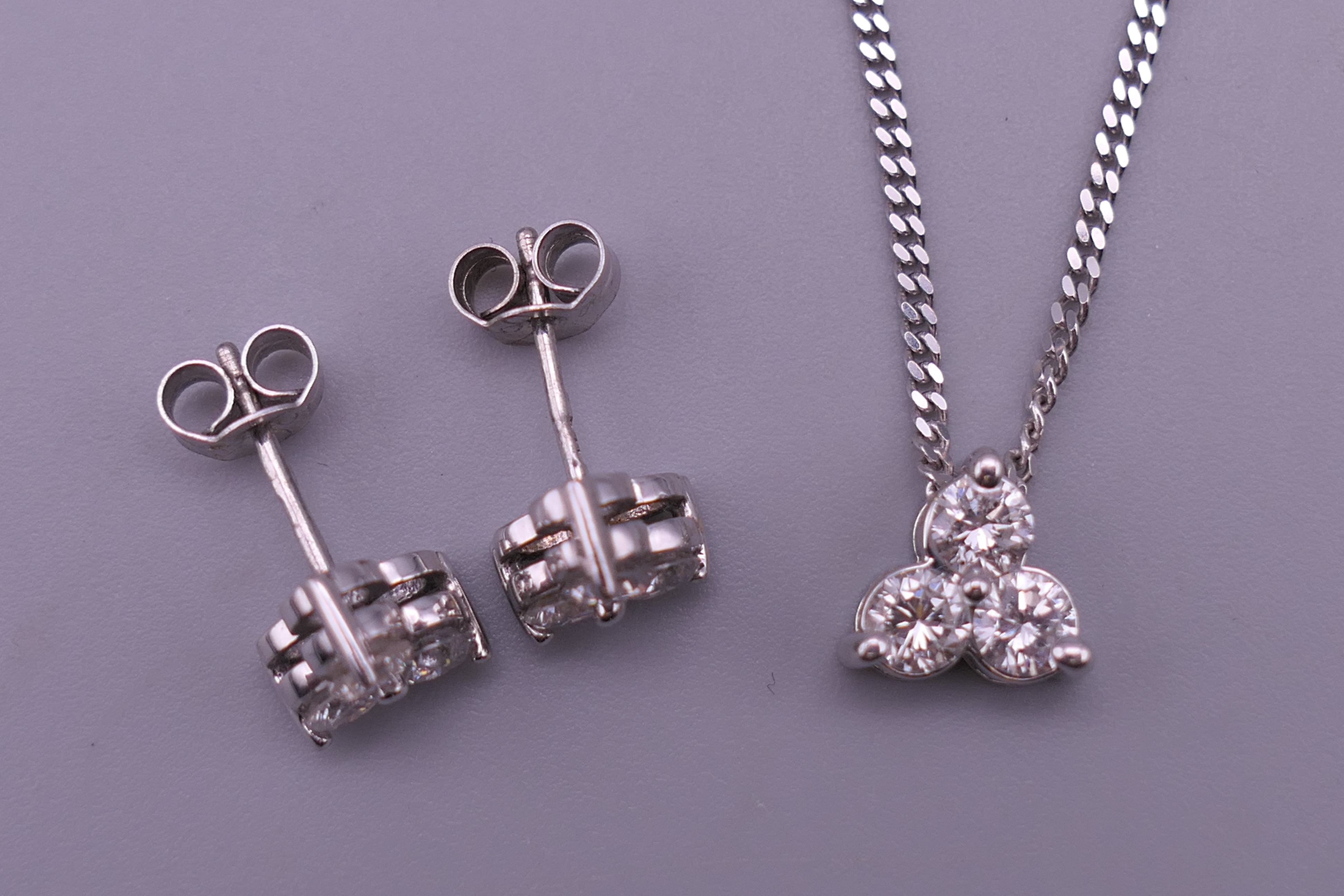 An 18 ct white gold and diamond necklace and pendant and a pair of matching earrings. - Image 2 of 8