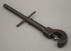 A vintage steel pipe cutter. 43 cm long.