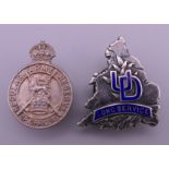 A silver UD (United Dairies) Long Service badge and a Regular Army Reserve of Officers badge.