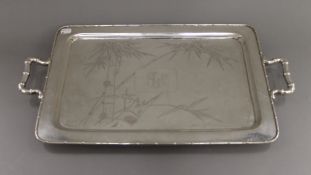 A Chinese sterling silver twin handled tray. 59 cm wide. 2403.8 grammes.