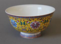 A Chinese yellow porcelain bowl. 13 cm diameter.