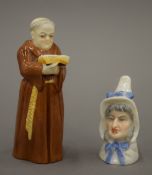 Two Royal Worcester candle snuffers, one formed as a monk, the other an old lady.
