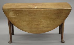 A 19th century mahogany pad foot drop leaf table. 130 cm long.