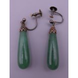 A pair of jade drop earrings. 5 cm high overall.