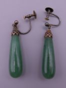 A pair of jade drop earrings. 5 cm high overall.