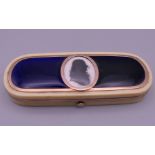 A late 18th/early 19th century unmarked gold and enamel mounted ivory toothpick box set with a