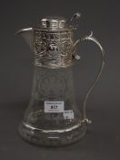 A silver plated and glass claret jug. 24.5 cm high.