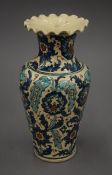 An Iznik style pottery vase. 28.5 cm high.