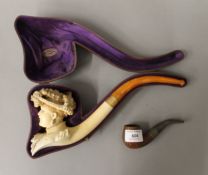 A Victorian cased meerschaum pipe formed as a lady and another pipe. 30 cm long, 10.5 cm high.
