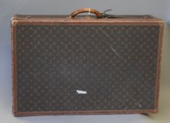 A Louis Vuitton suitcase. 81 cm wide.