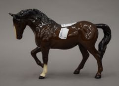 A Royal Doulton porcelain horse.