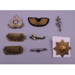 A collection of military badges (three for the Suffolk Regiment),