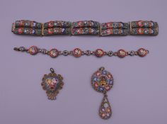 Two mosaic bracelets and two mosaic pendants.