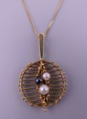 A 15 ct gold and seed pearl pendant on chain. Pendant 2.